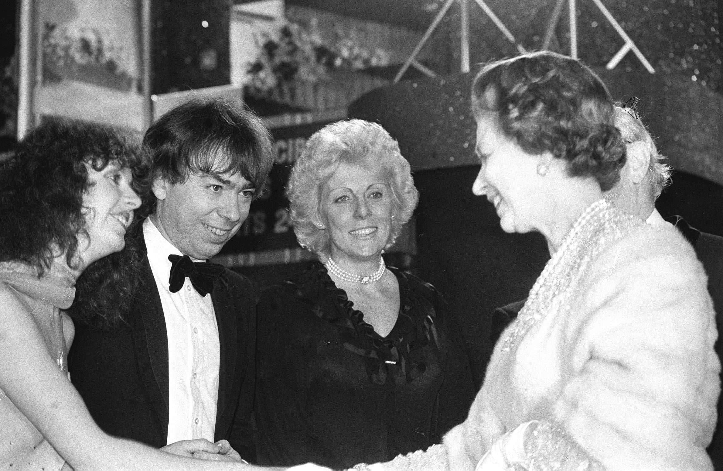 The Queen and composer Andrew Lloyd Webber at the Apollo Theatre, Victoria, London, in 1984 (Ron Bell/PA)