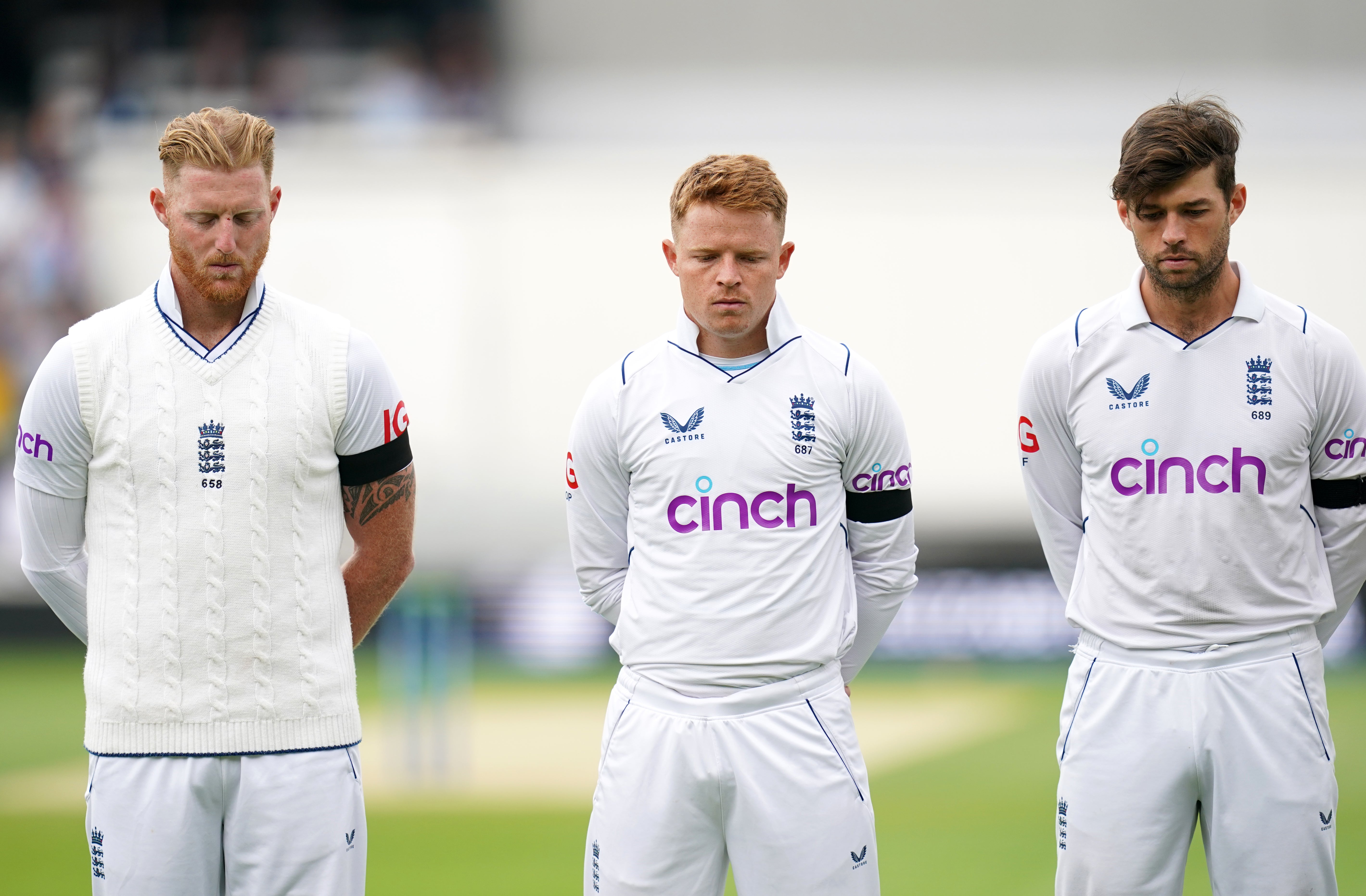 England players Ben Stokes, left, Ollie Pope, centre, and Ben Foakes observe a minute’s silence (John Walton/PA)