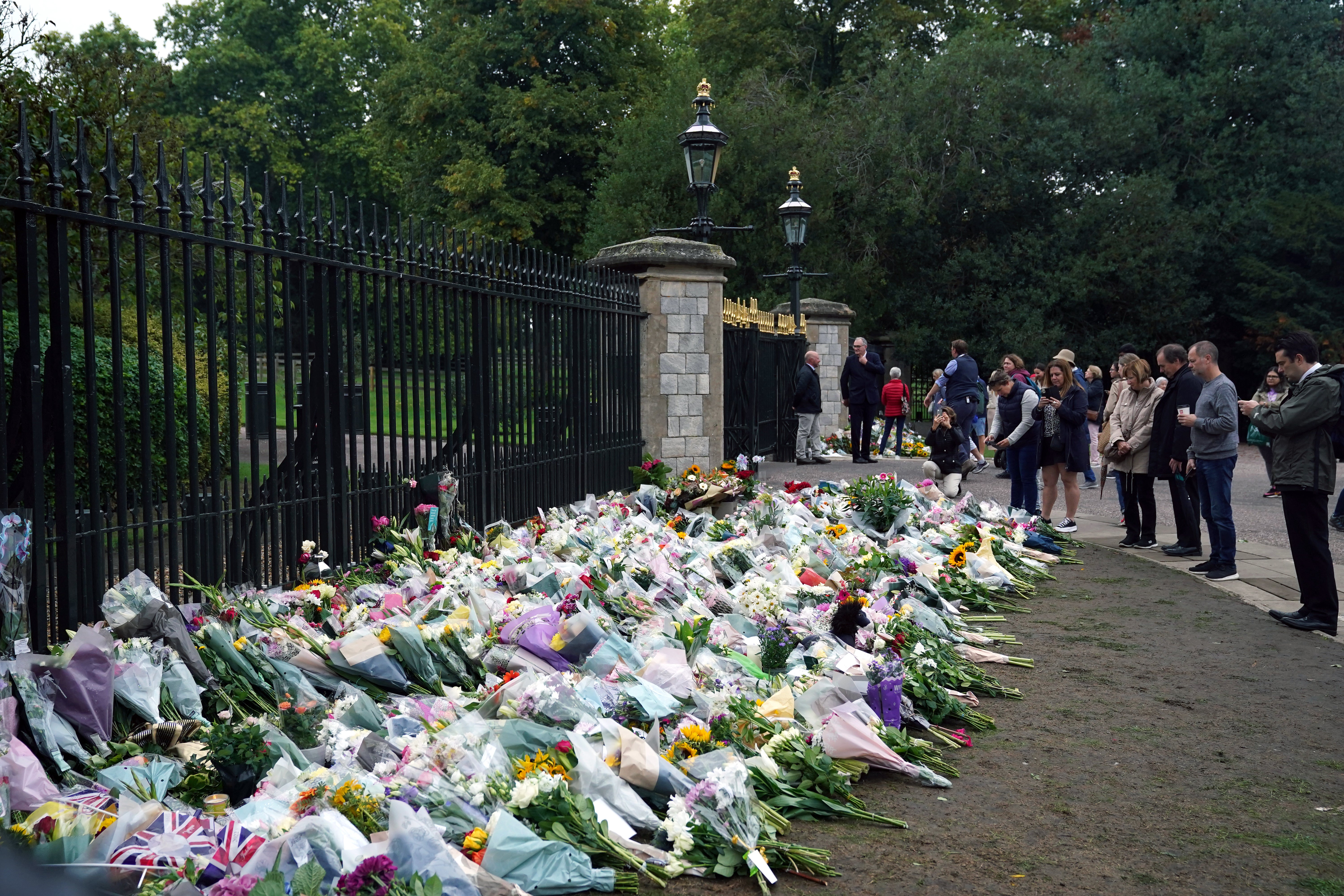 Flowers are laid outside of Windsor Castle, Berkshire (PA)