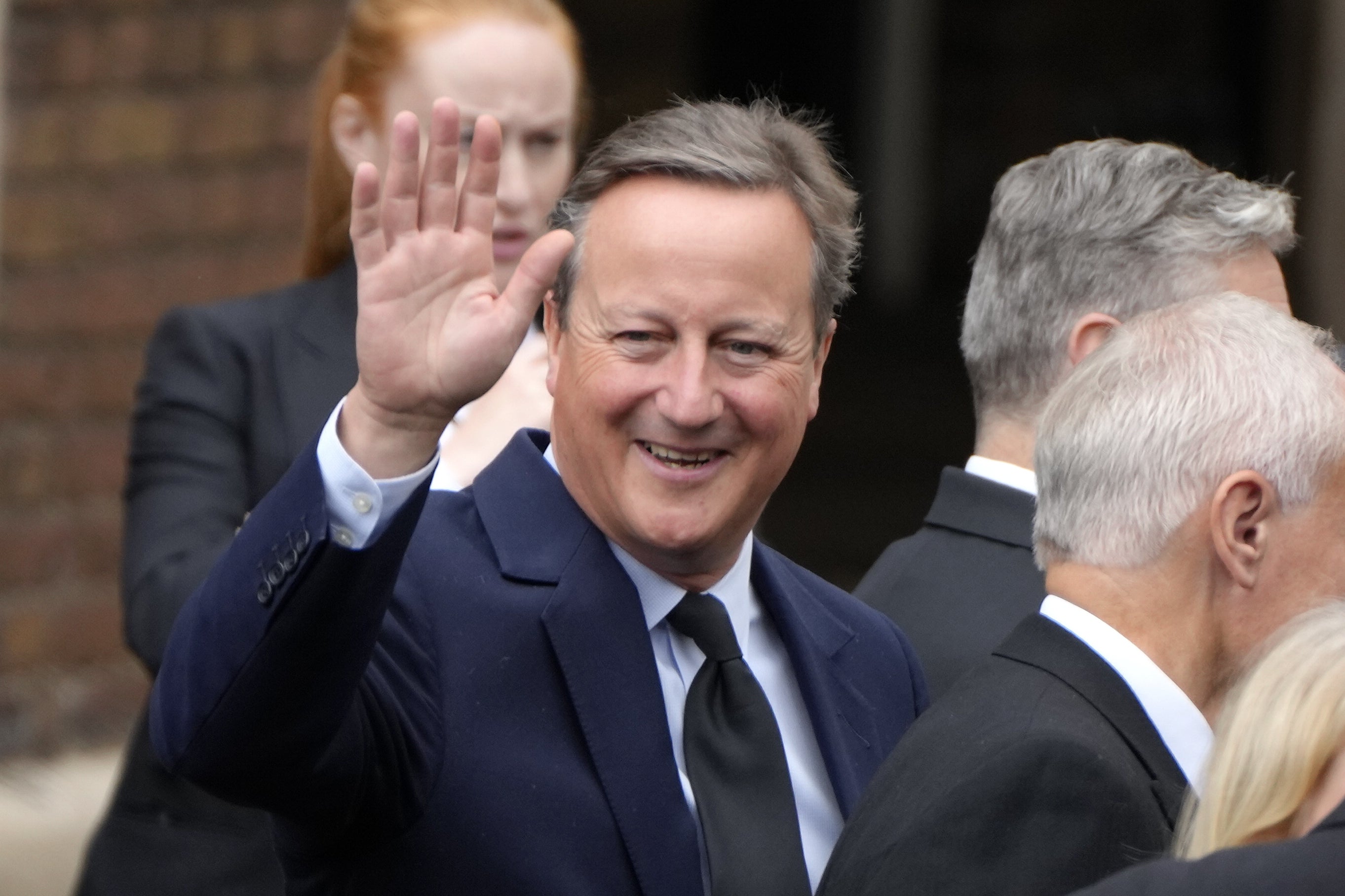 David Cameron leaves the ceremony (Kirsty Wigglesworth/PA)