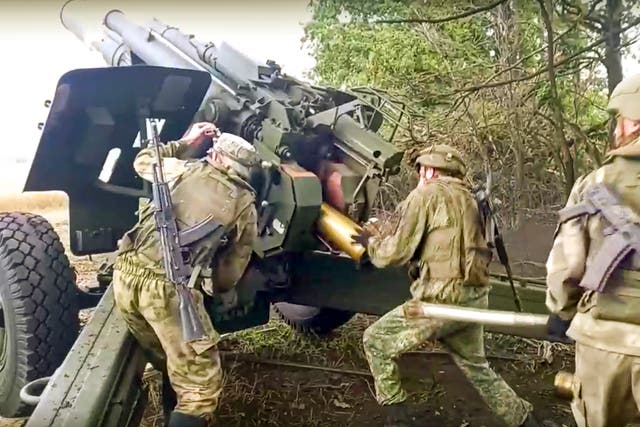 <p>Russian soldiers prepare to fire a Msta-B 152.4mm howitzer from their position at an undisclosed location in Ukraine on Saturday </p>