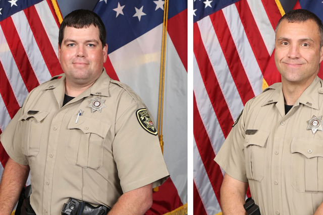 <p>Cobb County deputies Jonathan Koleski, right, and Marshall Ervin, left, were shot dead while executing an arrest warrant	</p>