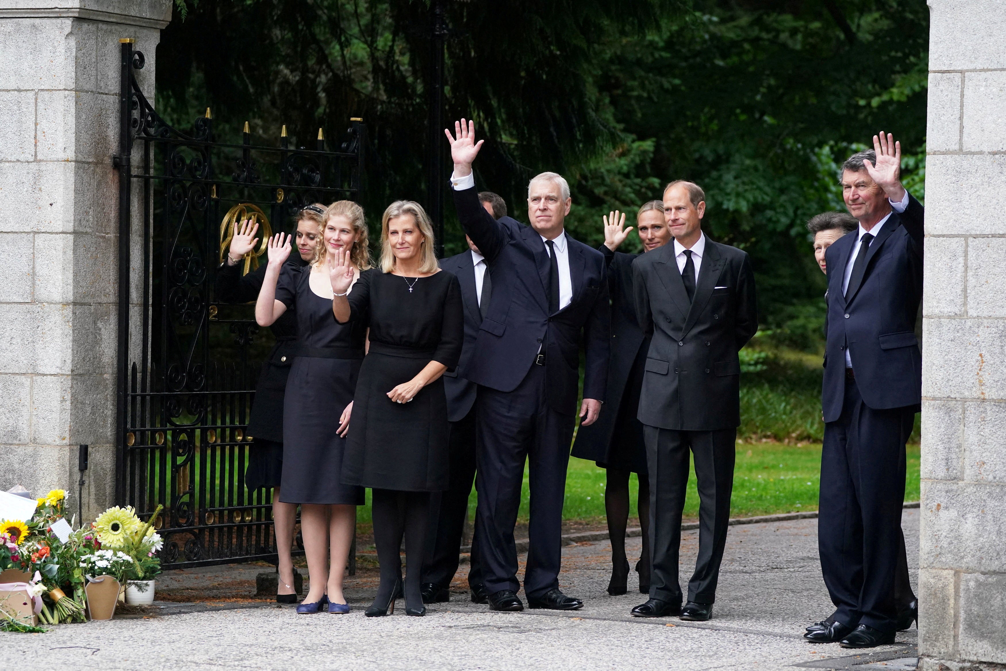Princess Beatrice, Lady Louise Windsor, Sophie, Countess of Wessex, Prince Andrew, Duke of York, Zara Tindall, Prince Edward, Earl of Wessex and Vice Admiral Timothy Laurence wave to well-wishers outside Balmoral Castle,