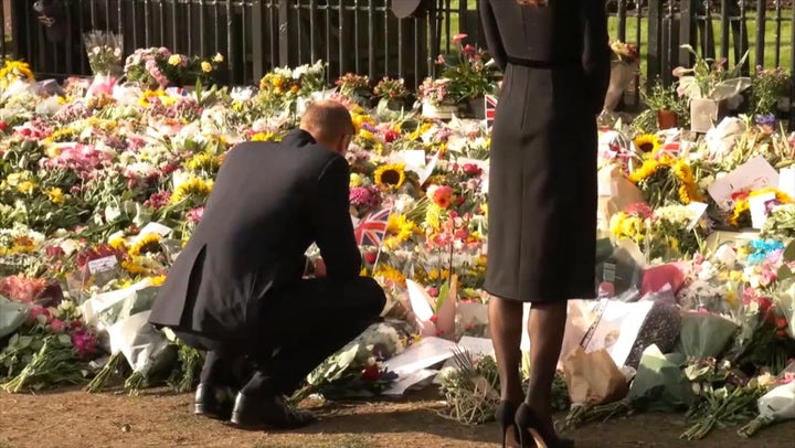 The Prince and Princess of Wales viewing flowers at the gates of Windsor Castle