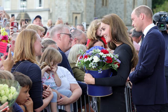 <p>William and Kate, the new Prince and Princess of Wales, speak to people outside Windsor Castle </p>