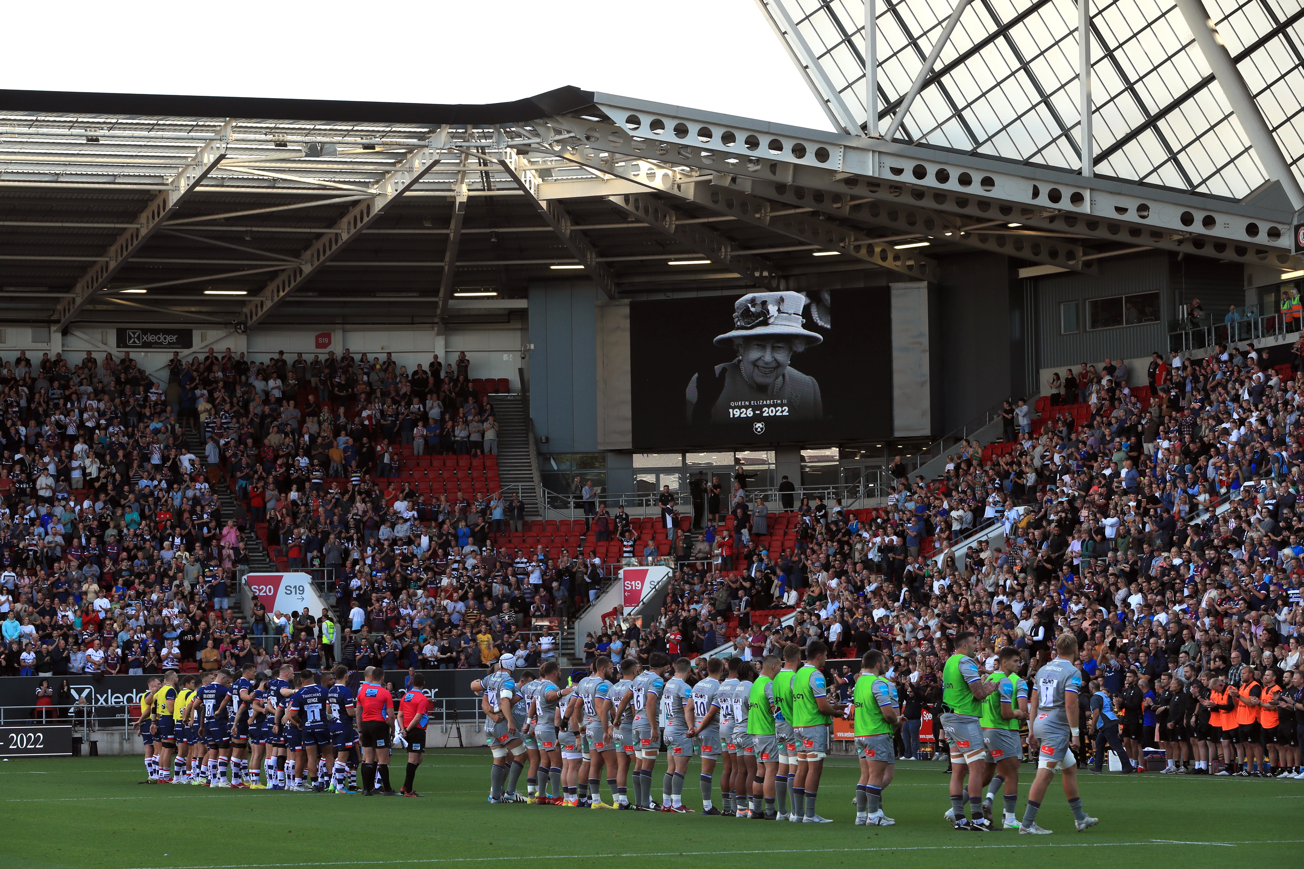Players and fans observe a minute’s silence in honour of the late Queen (Bradley Collyer/PA)