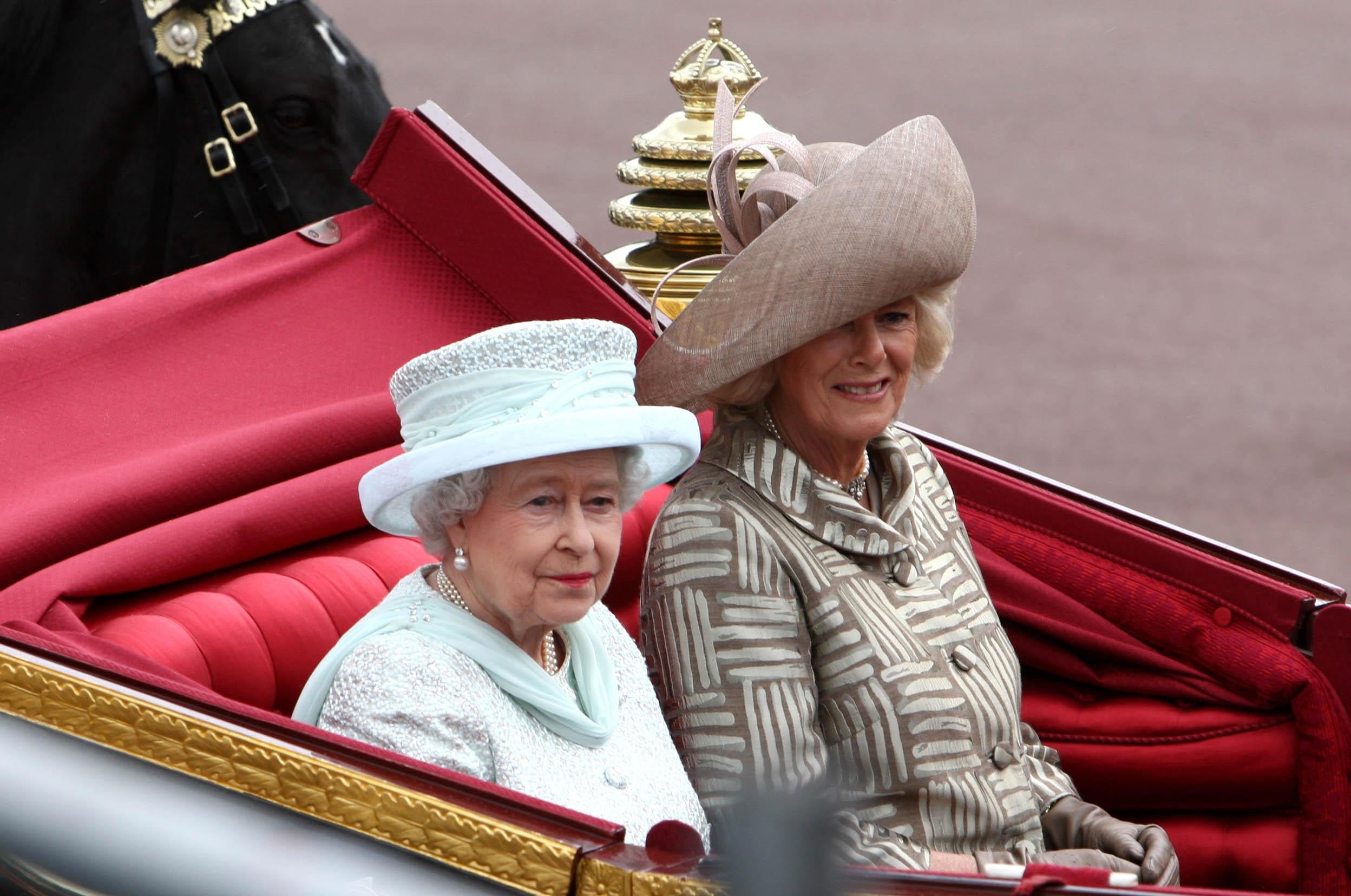 Queen Elizabeth II and the Duchess of Cornwall riding side by side in a carriage to Buckingham Palace during the Diamond Jubilee celebrations (David Jones/PA)