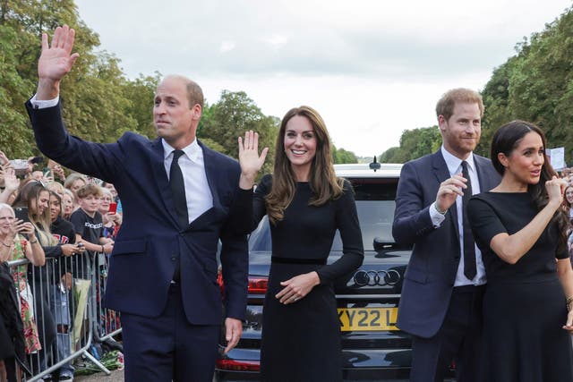 <p>William, Kate, Harry and Meghan acknowledge the crowds in Windsor on Saturday </p>