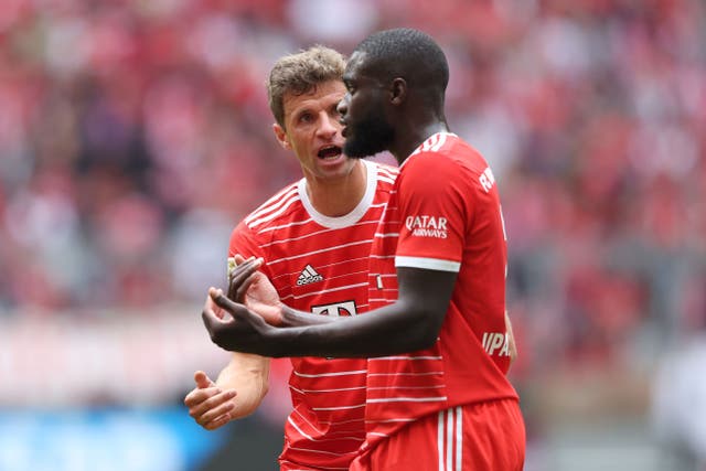 <p>Thomas Muller and Dayot Upamecano argue on the pitch</p>