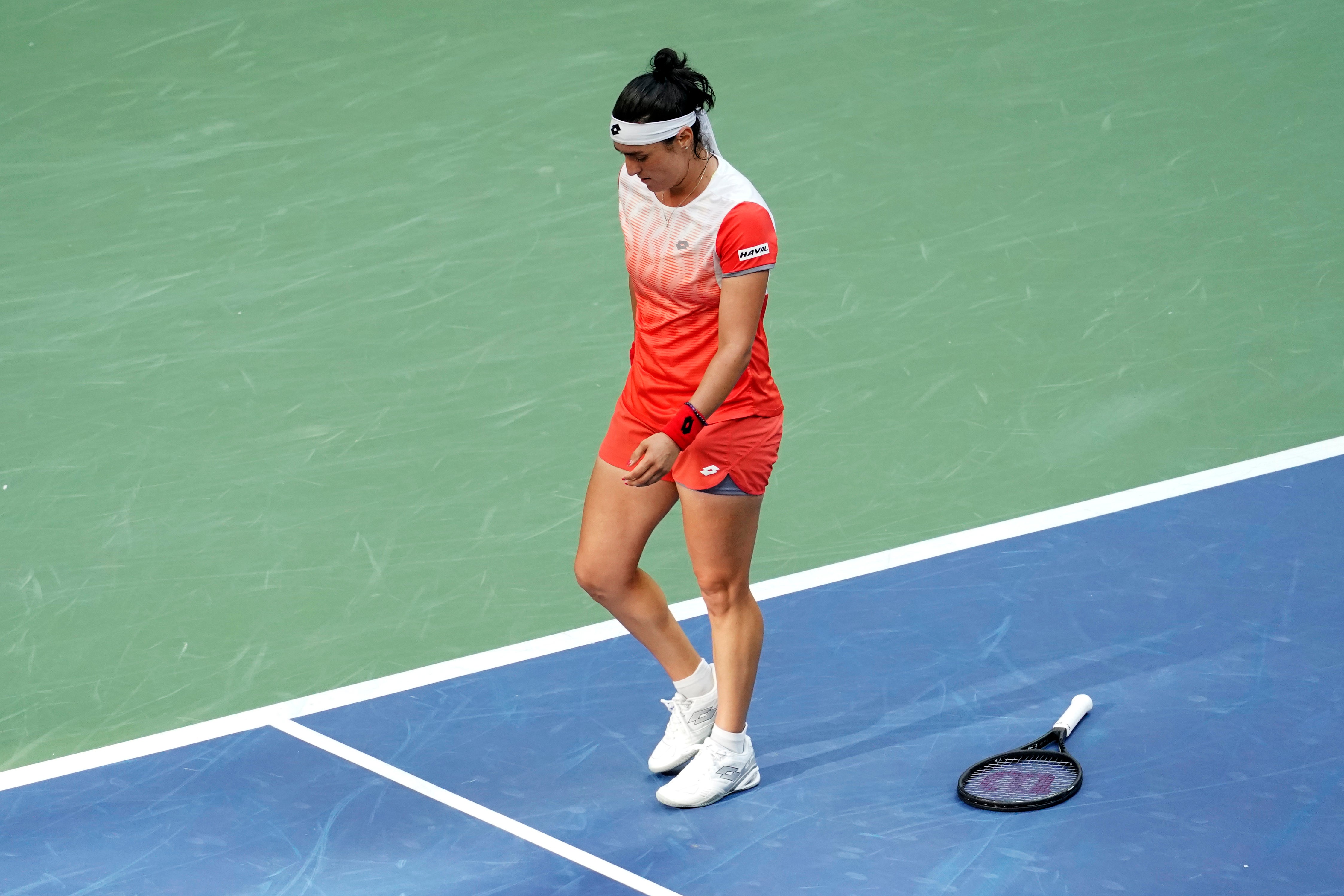 Ons Jabeur drops her racket in frustration (Mary Altaffer/AP)
