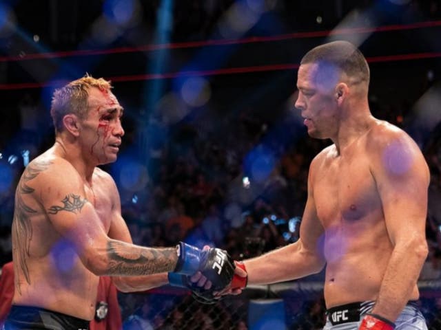 <p>Nate Diaz (right) is congratulated by beaten opponent Tony Ferguson</p>