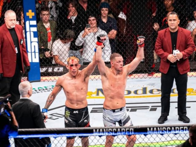 <p>Tony Ferguson (left) congratulates his victorious opponent Nate Diaz</p>