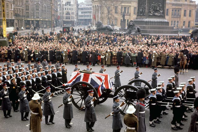 <p>The gun carriage carrying the coffin of Sir Winston Churchill crossing Trafalgar Square, London, during his state funeral</p>