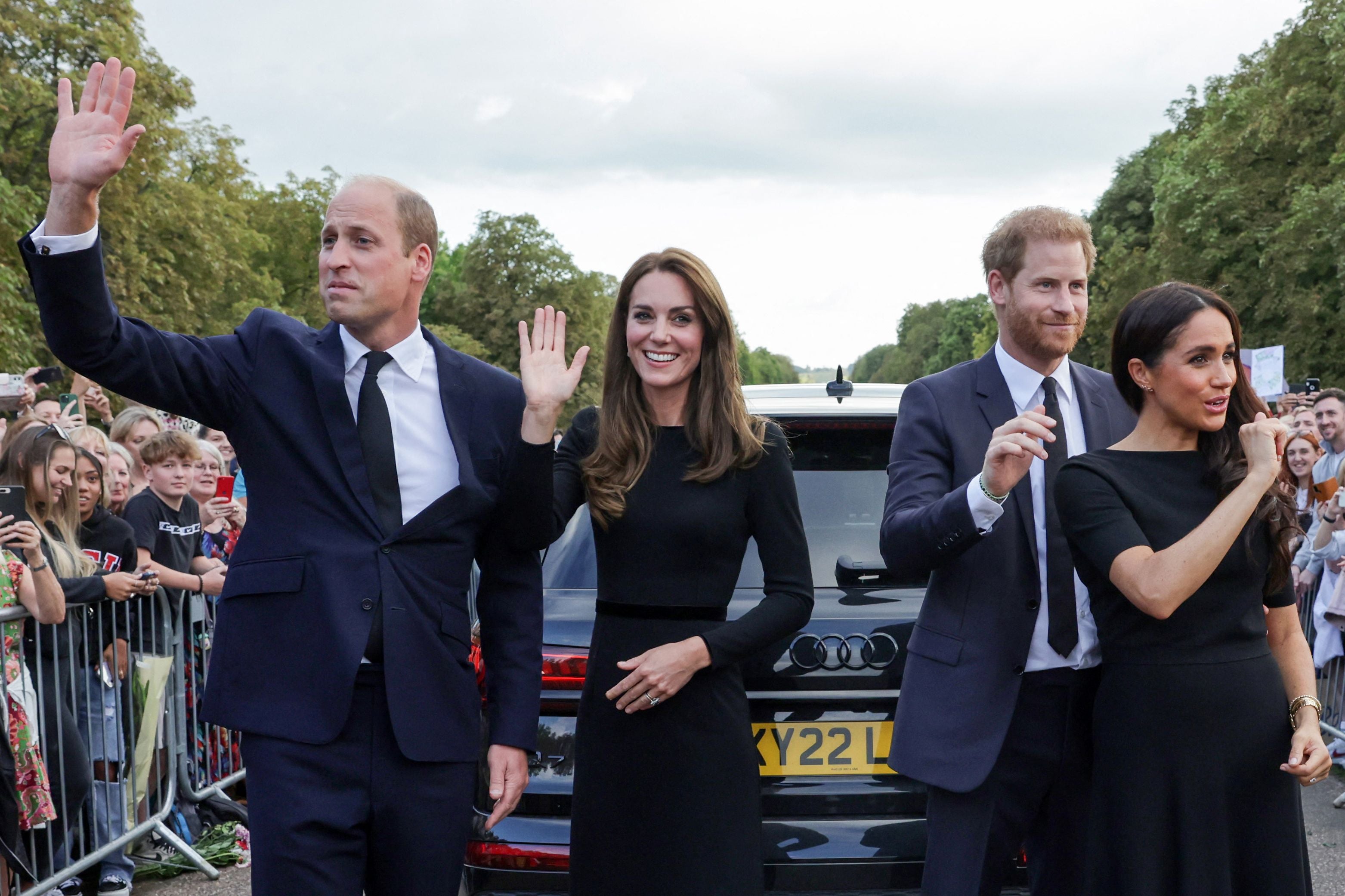 The royal couples wave at well-wishers on the Long walk at Windsor Castle