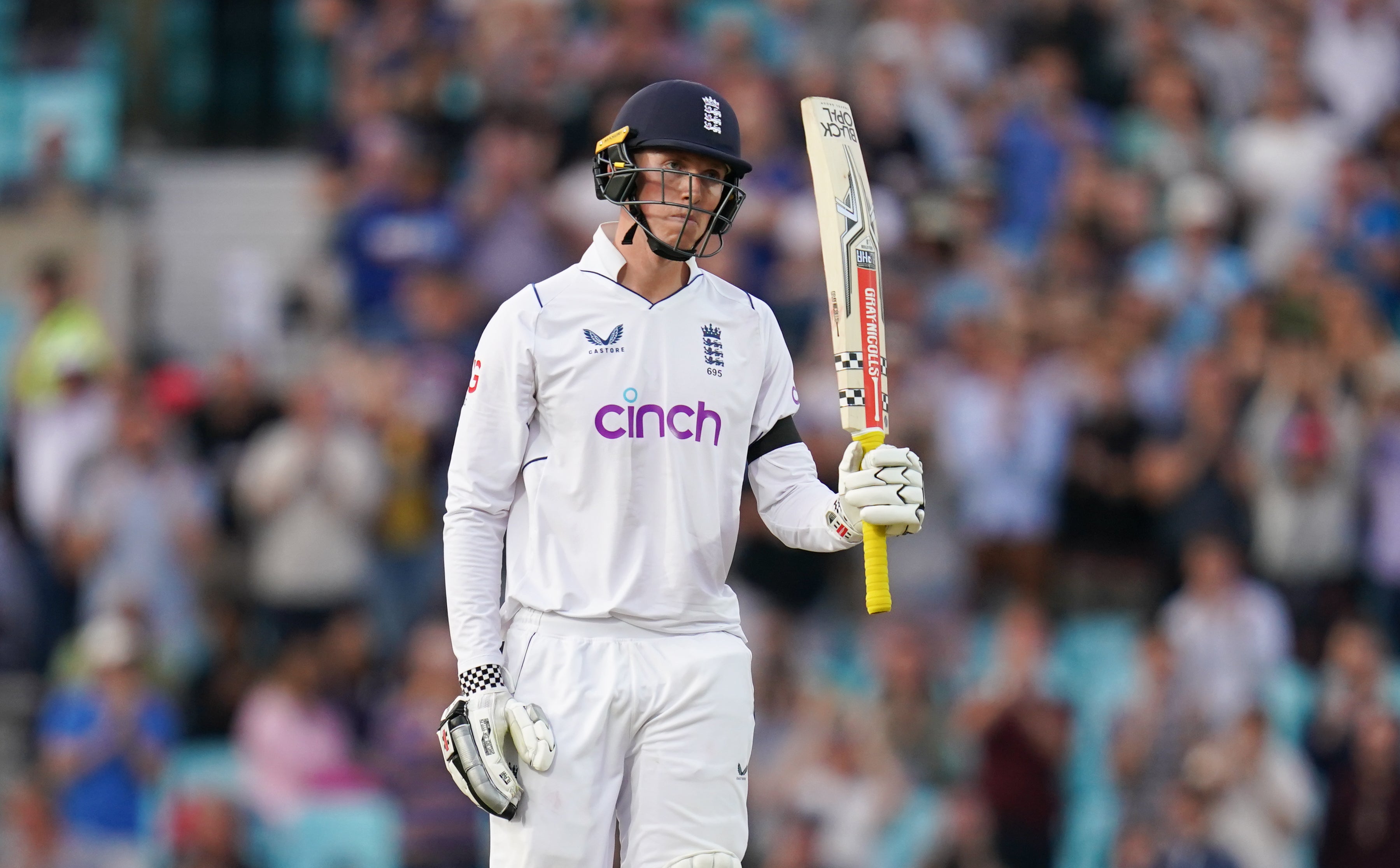 England’s Zak Crawley raises his bat after scoring a half-century (John Walton/PA)