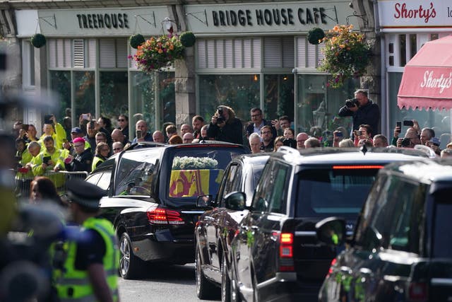 The hearse carrying the coffin of Queen Elizabeth II passing through Ballater (Andrew Milligan/PA)