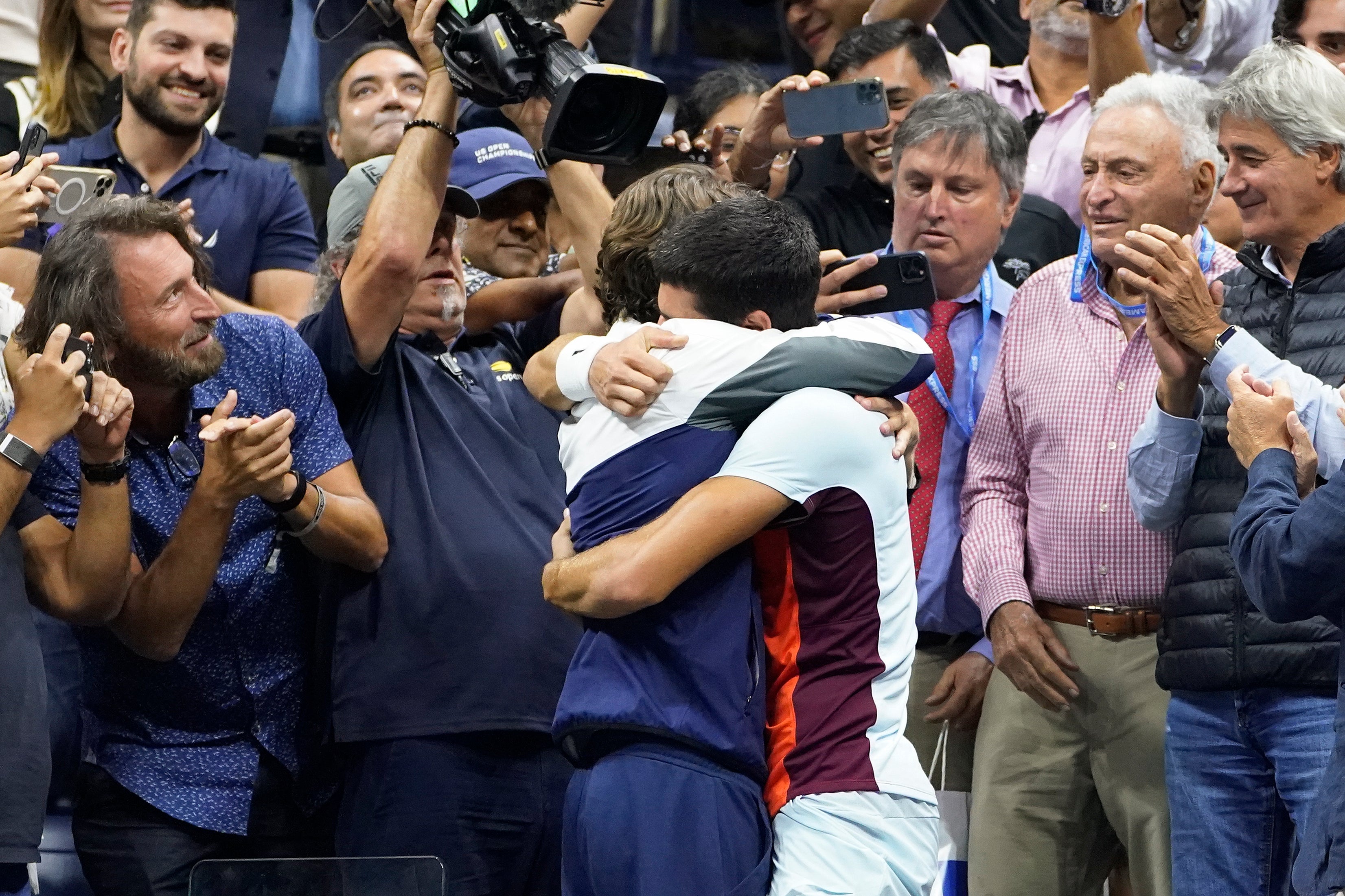 Carlos Alcaraz hugs coach Juan Carlos Ferrero (John Minchillo/AP)