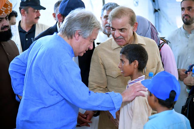 <p>UN secretary general Antonio Guterres interacts with children at a school set up at a flood relief camp in Jaffarabad, Pakistan</p>