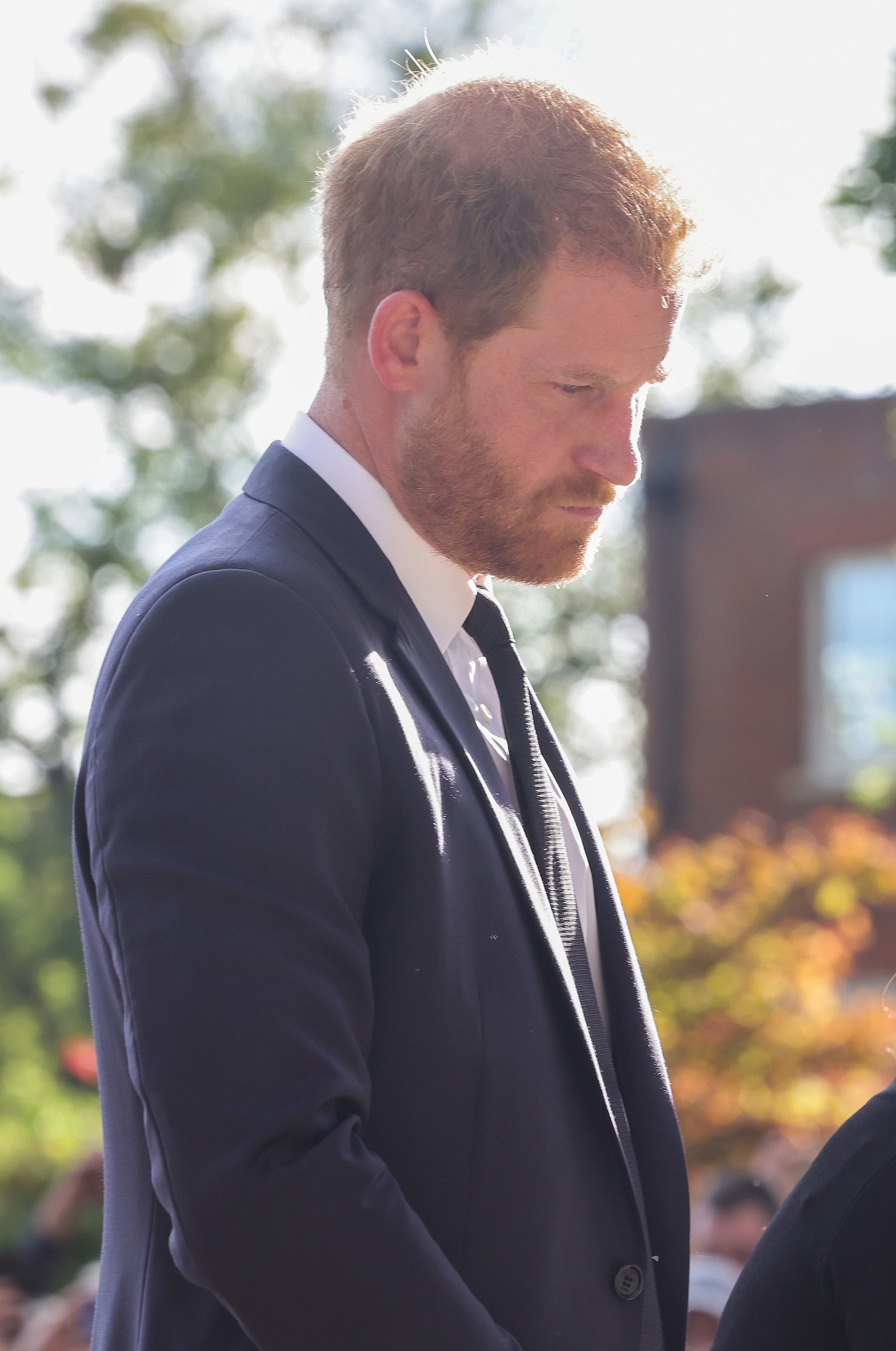 The Duke of Sussex viewing the messages and floral tributes left by members of the public at Windsor Castle in Berkshire following the death of Queen Elizabeth II (PA)