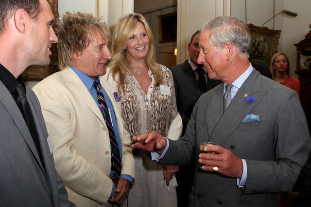 Rod Stewart and Penny Lancaster are greeted by King Charles III (Tim Whitby/PA)