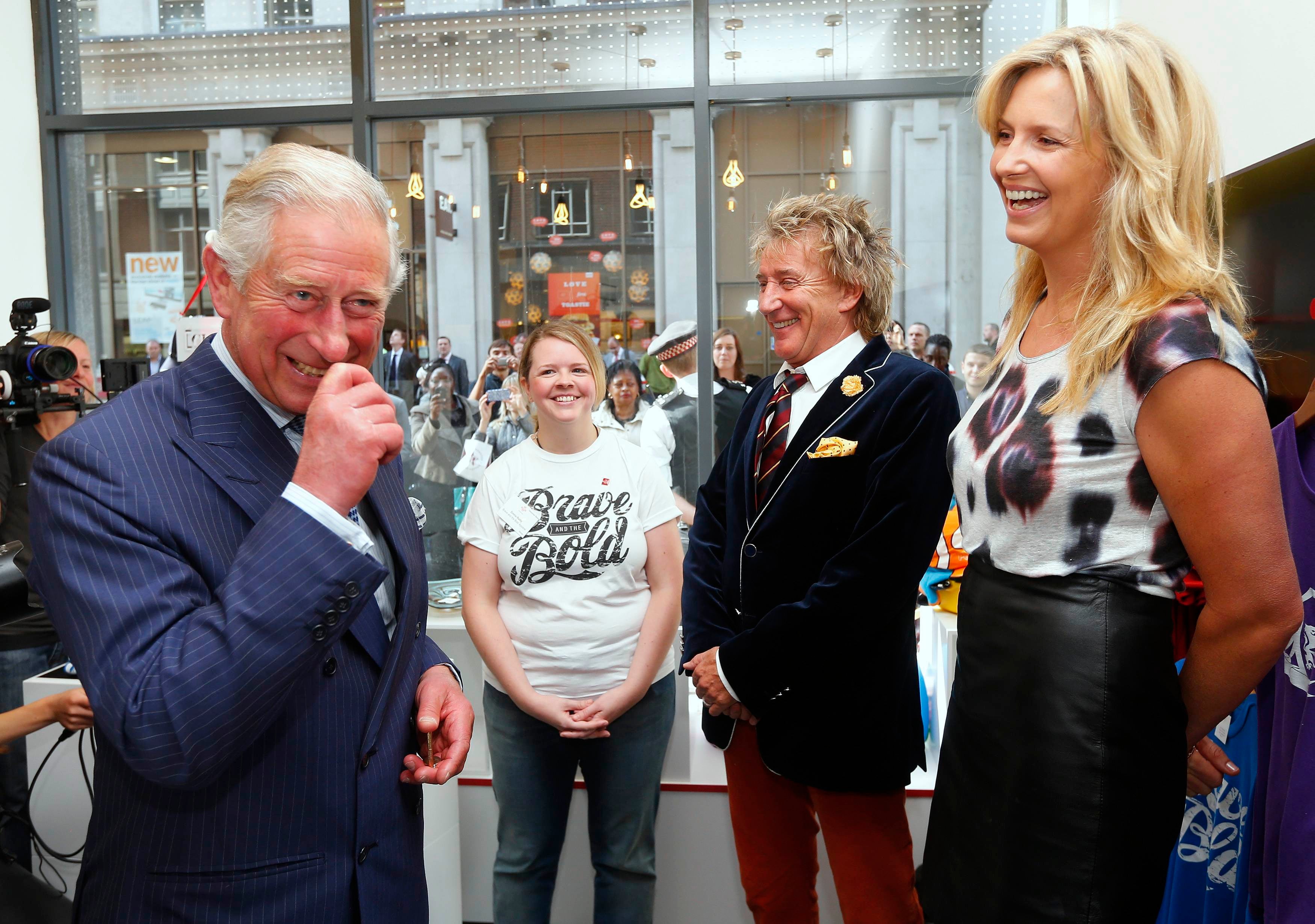 Charles as he speaks with Penny Lancaster and Sir Rod Stewart (Andrew Winning/PA)