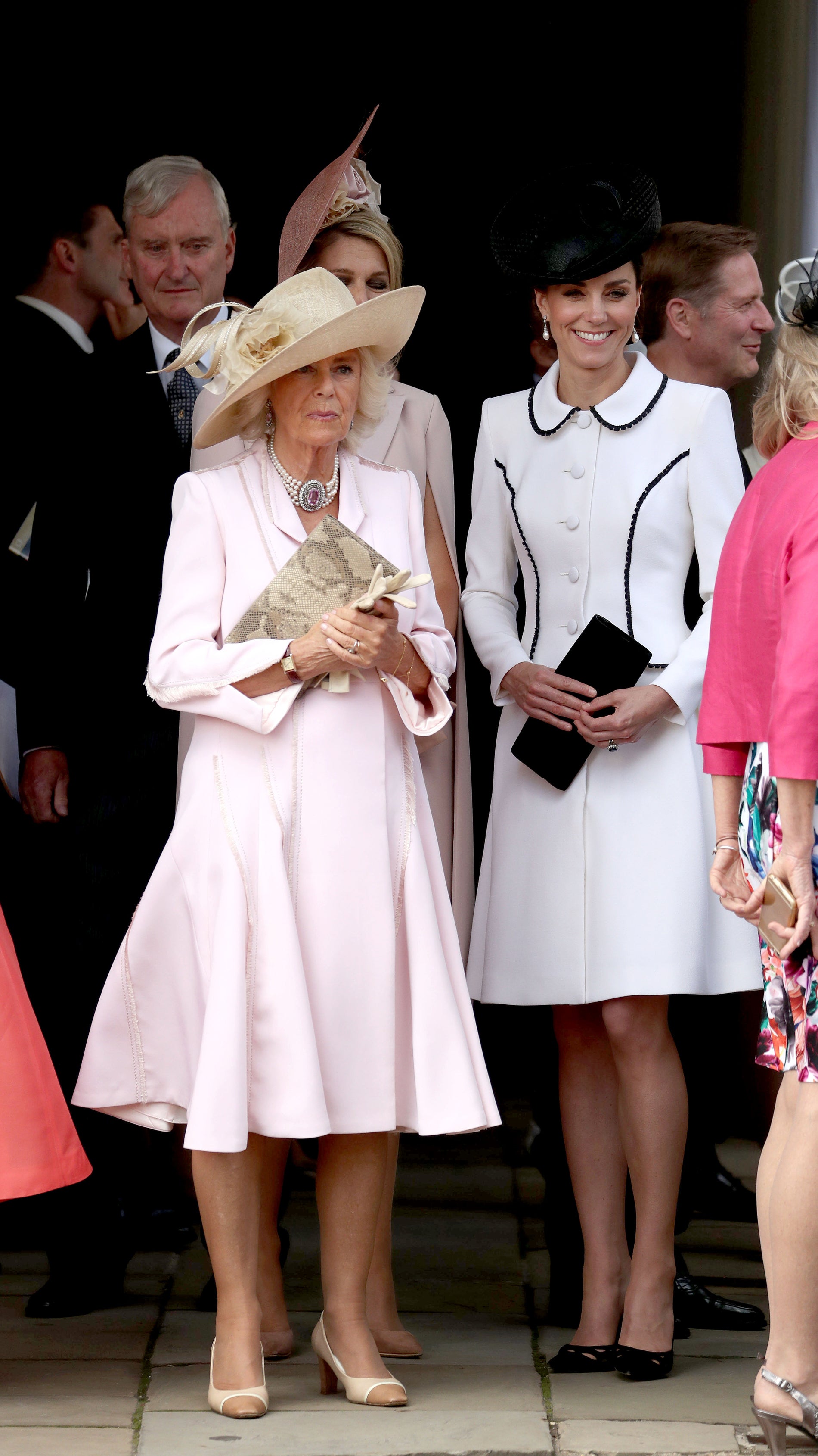 The Duchess of Cornwall (left) and the Duchess of Cambridge, stand together as they watch the annual Order of the Garter Service at St George’s Chapel (Steve Parsons/PA)