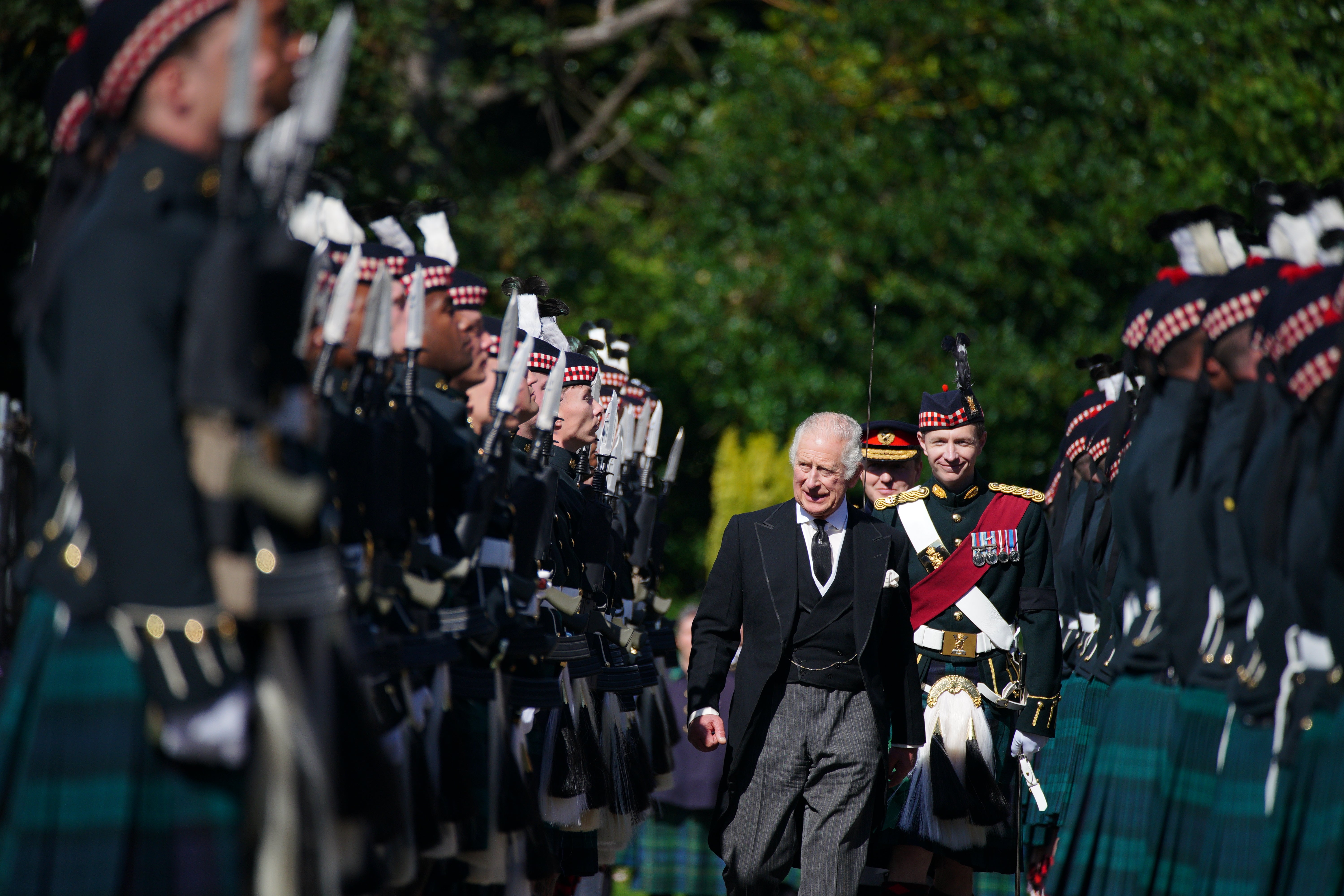 King Charles III inspects the Guard of Honour as he takes part in the Ceremony of the Keys at the Palace of Holyroodhouse (Peter Byrne/PA)
