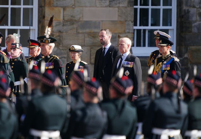 The King (second left), the Princess Royal (centre), the Duke of York (second right) and the Earl of Wessex (right) watch as their mother’s coffin is removed from the Palace of Holyroodhouse (Jon Super/PA)