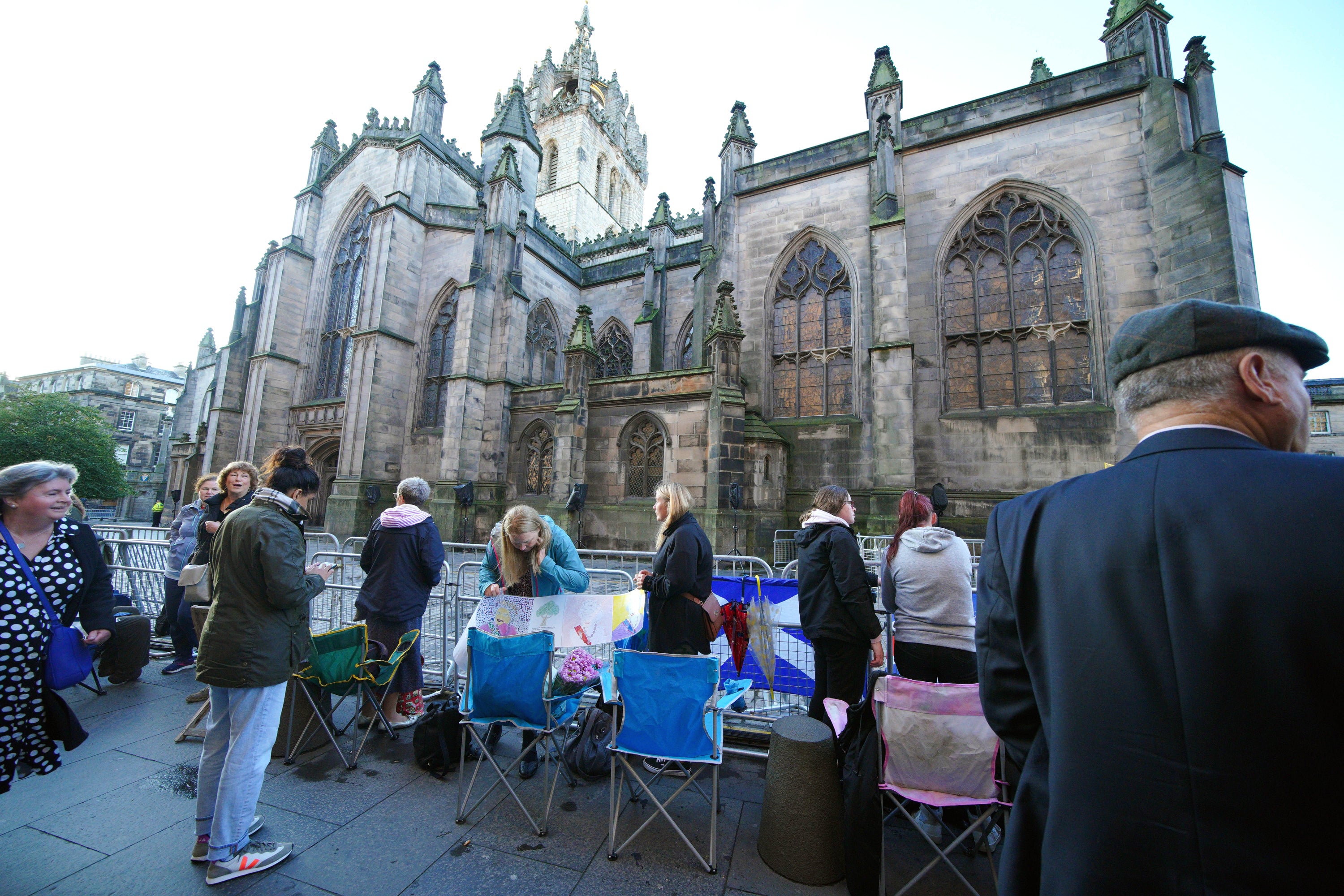 People gathered outside St Giles’ Cathedral in Edinburgh ahead of Monday’s service. (Peter Byrne/PA)
