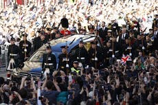 ‘A very special moment in time’: Hundreds of thousands pack Edinburgh streets for Queen’s coffin procession