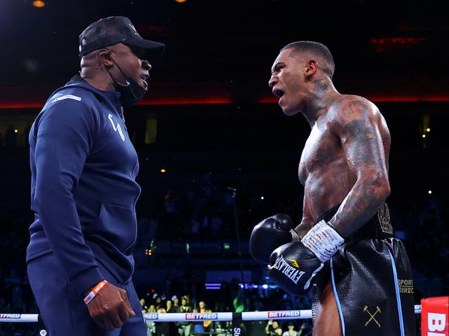 <p>Conor Benn (right) celebrates with father Nigel in December 2021</p>