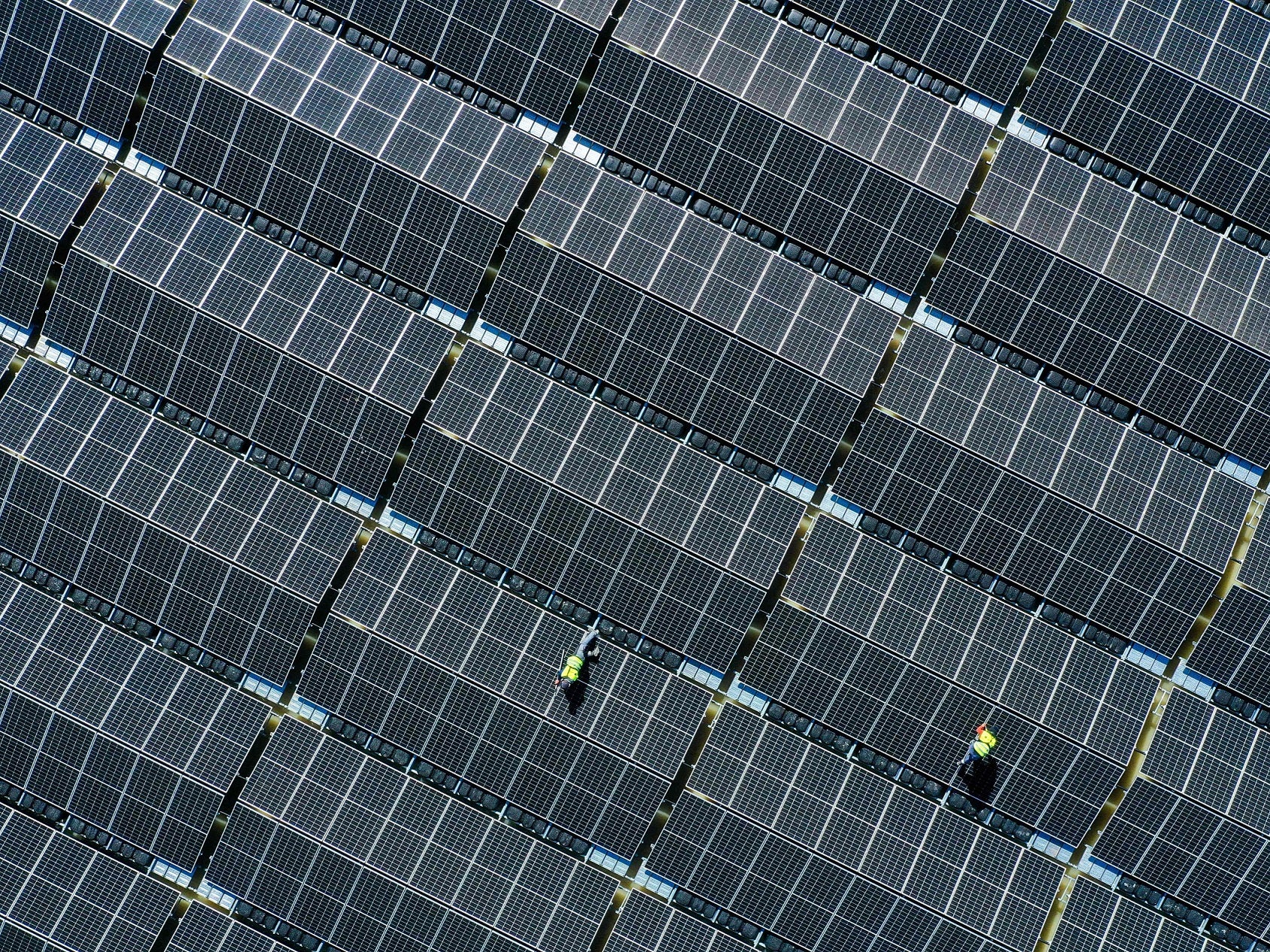 An aerial view shows solar panels at a floating photovoltaic plant on the Silbersee lake in Haltern, Germany’s largest floating solar park, on 22 April, 2022