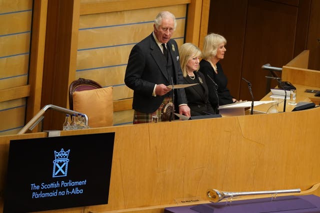 The King, accompanied by the Queen Consort, addressed MSPs during a debate on a motion of condolence in honour of the Queen (Andrew Milligan/PA)