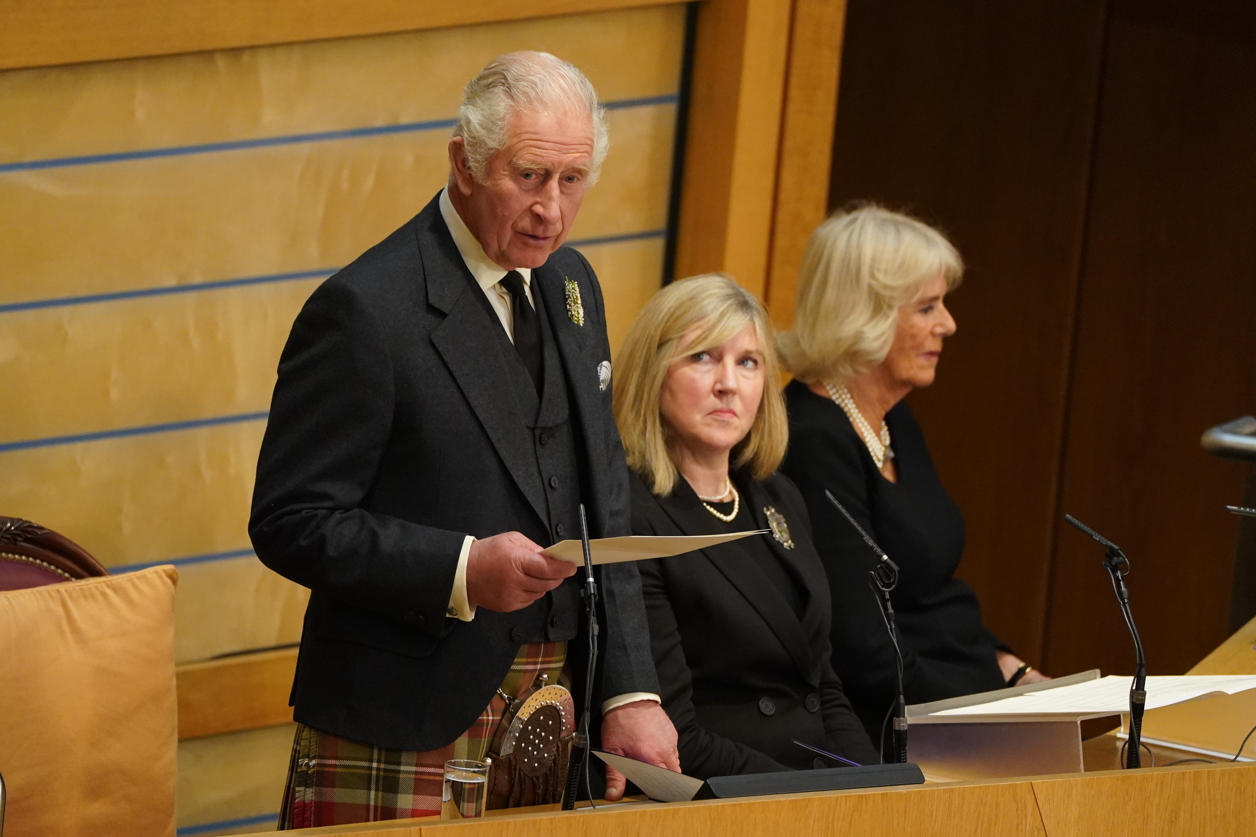 King Charles III speaking in the Scottish Parliament after hearing tributes to the Queen. Andrew Milligan/PA