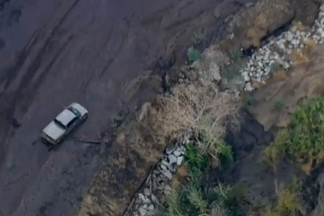 <p>A car is stuck in the mud after mudslides in northern Los Angeles County</p>
