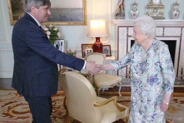 Queen Elizabeth II receives Simon Armitage (Jonathan Brady/PA)