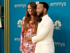 Chrissy Teigen and John Legend cradle her baby bump on 2022 Emmys red carpet