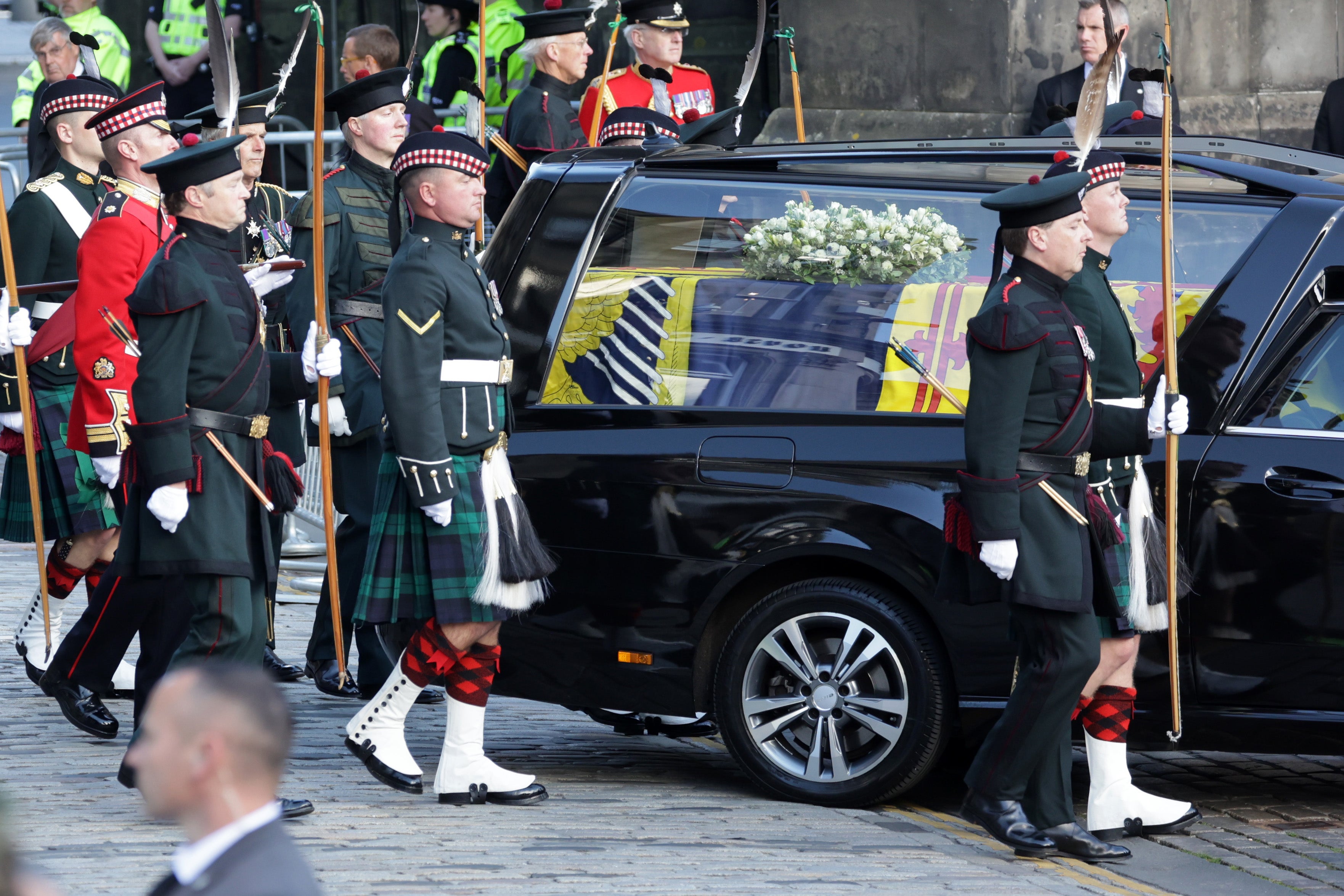 Queen Elizabeth II funeral cortege makes its way along The Royal Mile towards St Giles Cathedral on 12 September 2022 in Edinburgh, Scotland