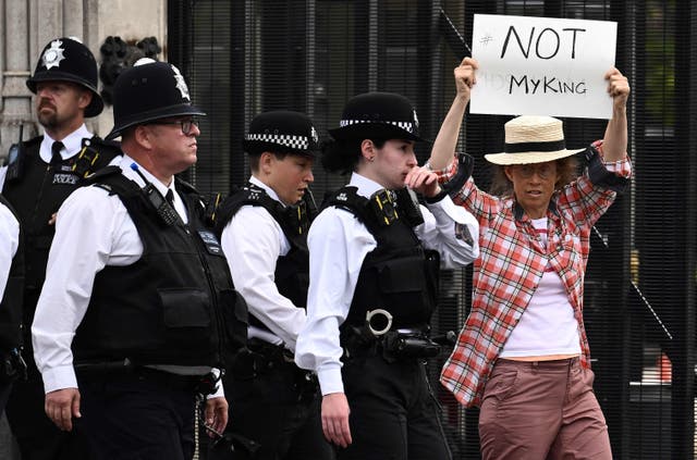<p>An anti-Royal demonstrator protests outside Palace of Westminster</p>