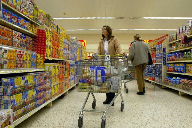 <p>Consumers are now paying a record £571 more on average for their groceries than last year, new figures show (Martin Rickett/PA)</p>