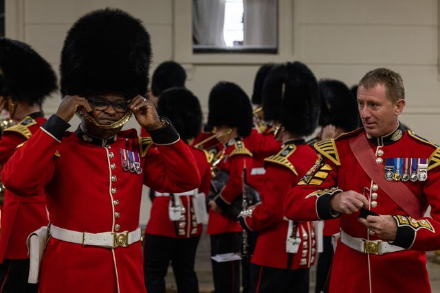 Members of the Household Division making final adjustments to their uniform ahead of the final full dress rehearsal (Corporal Paul Watson/MOD/PA)