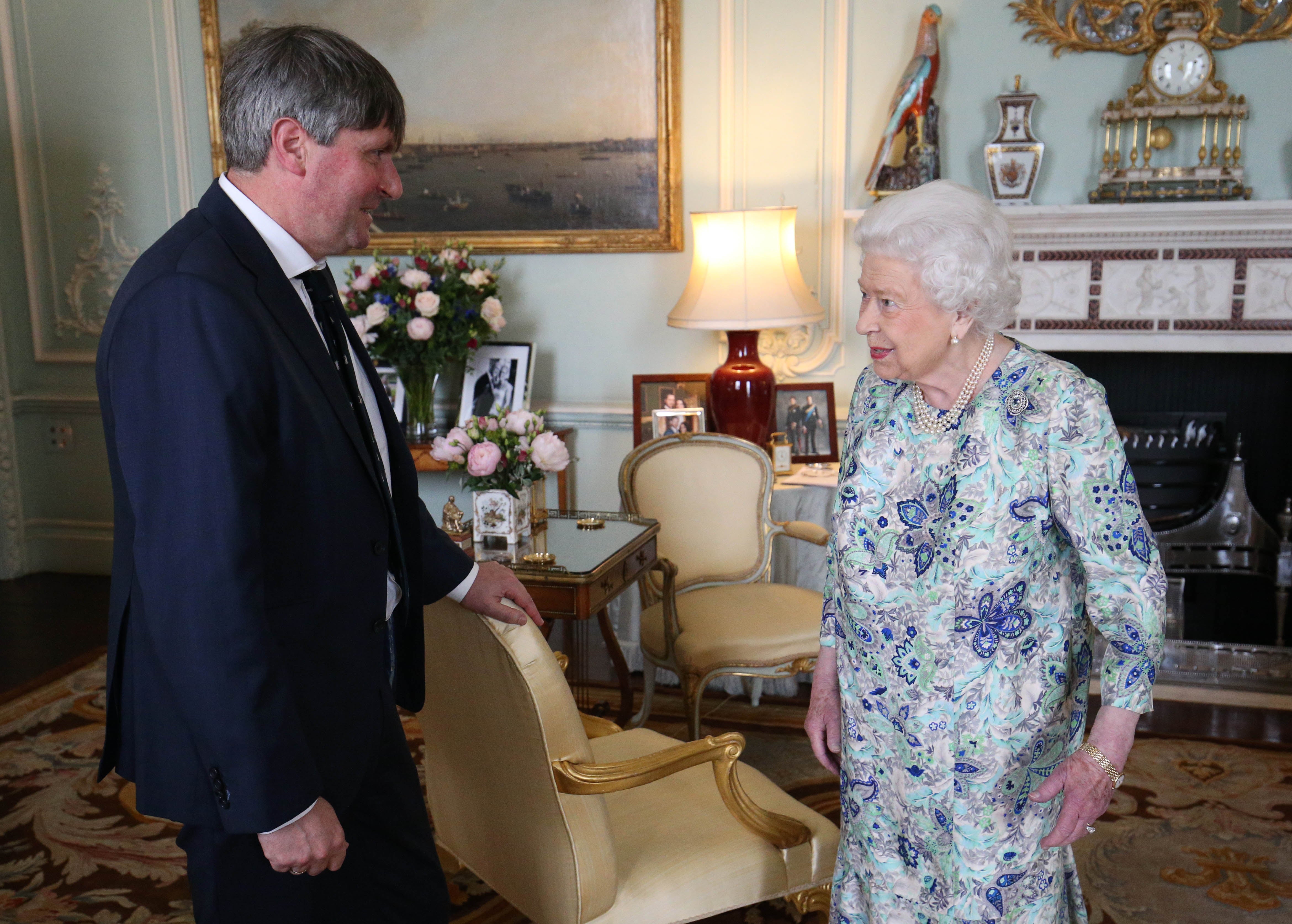 The Queen receives Simon Armitage to present him with the Queen’s Gold Medal for Poetry upon his appointment as Poet Laureate during an audience at Buckingham Palace, London, in 2019 (Jonathan Brady/PA)