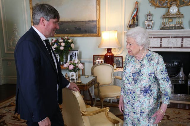 The Queen receives Simon Armitage to present him with the Queen’s Gold Medal for Poetry upon his appointment as Poet Laureate during an audience at Buckingham Palace, London, in 2019 (Jonathan Brady/PA)