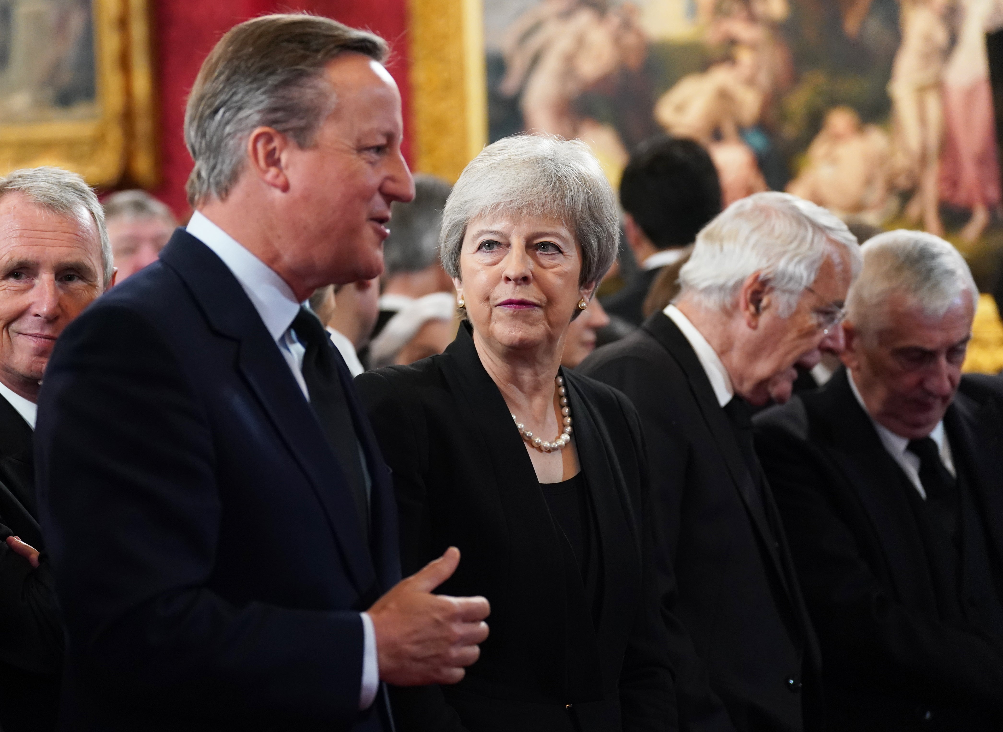 Former prime ministers David Cameron and Theresa May attend the Accession Council ceremony (PA)