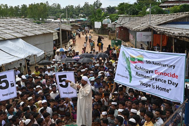 <p>Rohingya refugees take part in ‘Genocide Remembrance Day’ rally to mark the 5th anniversary since fleeing Myanmar from a military offensive, at a refugee camp in Ukhia on 25 August 2022</p>