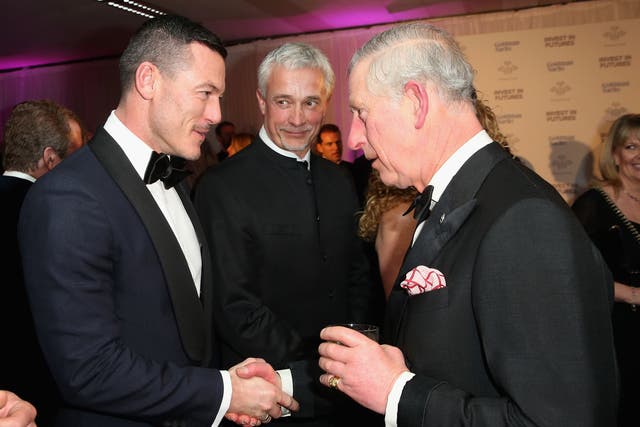 Luke Evans talks to the Prince of Wales – now King Charles III – as they attend a pre-dinner reception for the Prince’s Trust Invest in Futures Gala Dinner at The Old Billingsgate in London in 2016 (Chris Jackson/PA)