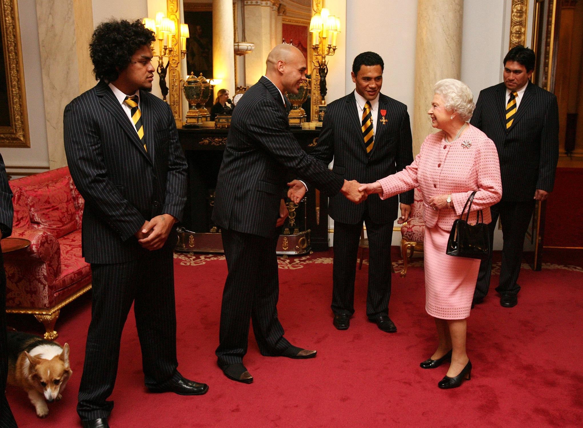 The Queen was introduced to the members of the New Zealand rugby league team inside the Bow Room at Buckingham Palace in 2005 (Johnny Green/PA)