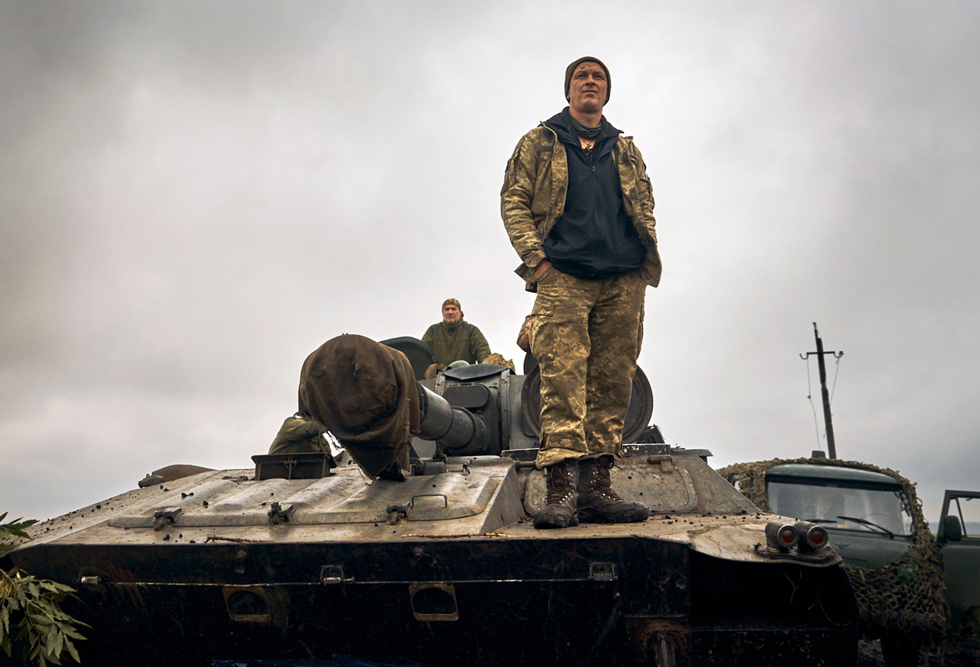 A Ukrainian soldier stands on a tank in a recently liberated part of Kharkiv province.