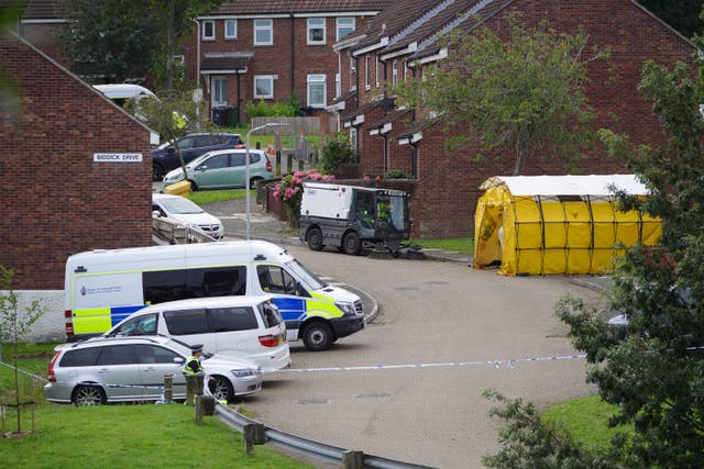 A street cleaner in Biddick Drive in the Keyham area of Plymouth, Devon, where five people were killed by gunman Jake Davison in a firearms incident on Thursday evening. Picture date: Sunday August 15, 2021.