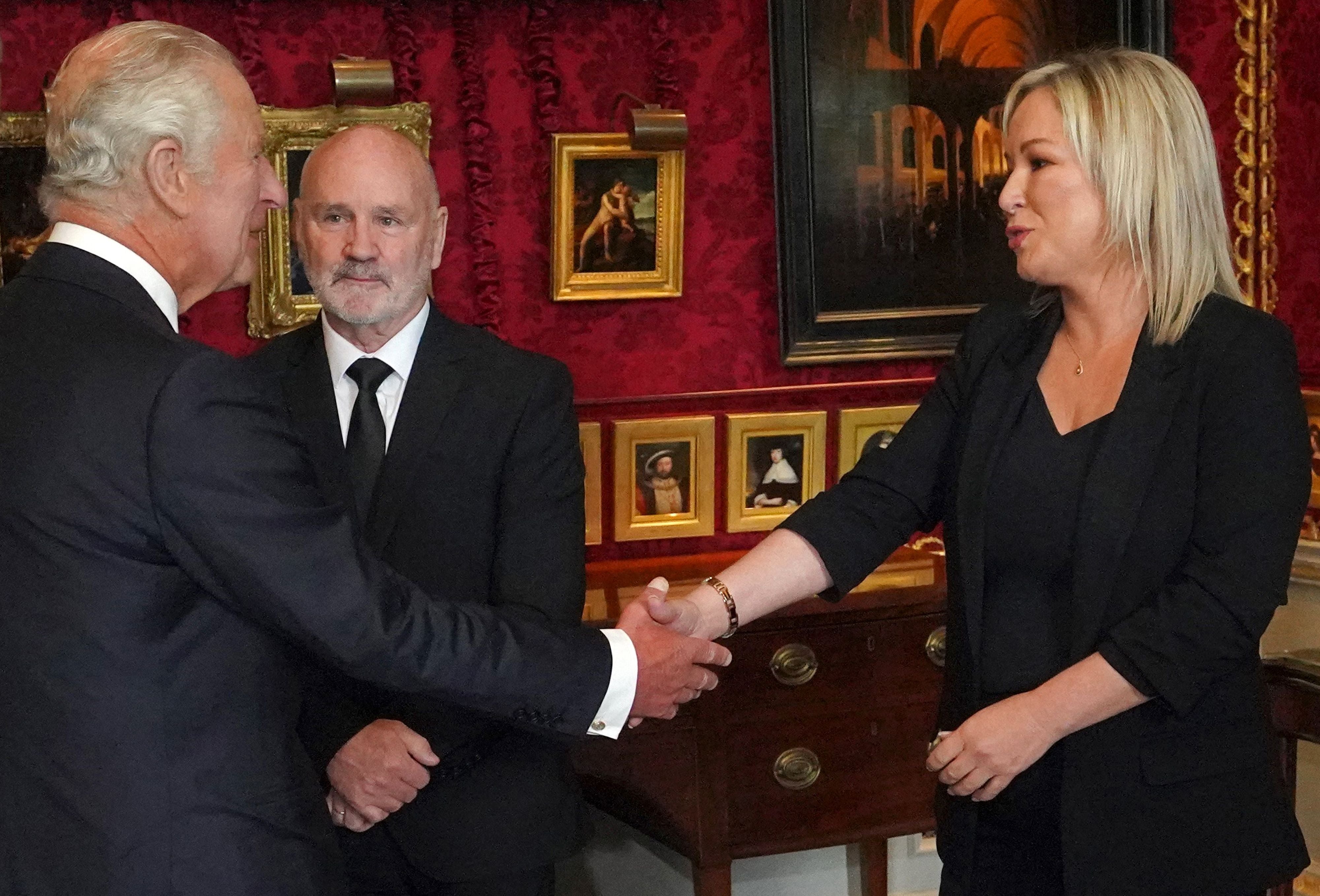 Stormont speaker Alex Maskey, who was interned by British authorities during the Troubles, looks on as King Charles meets Sinn Fein leader Michelle O’Neill in Belfast on Tuesday.